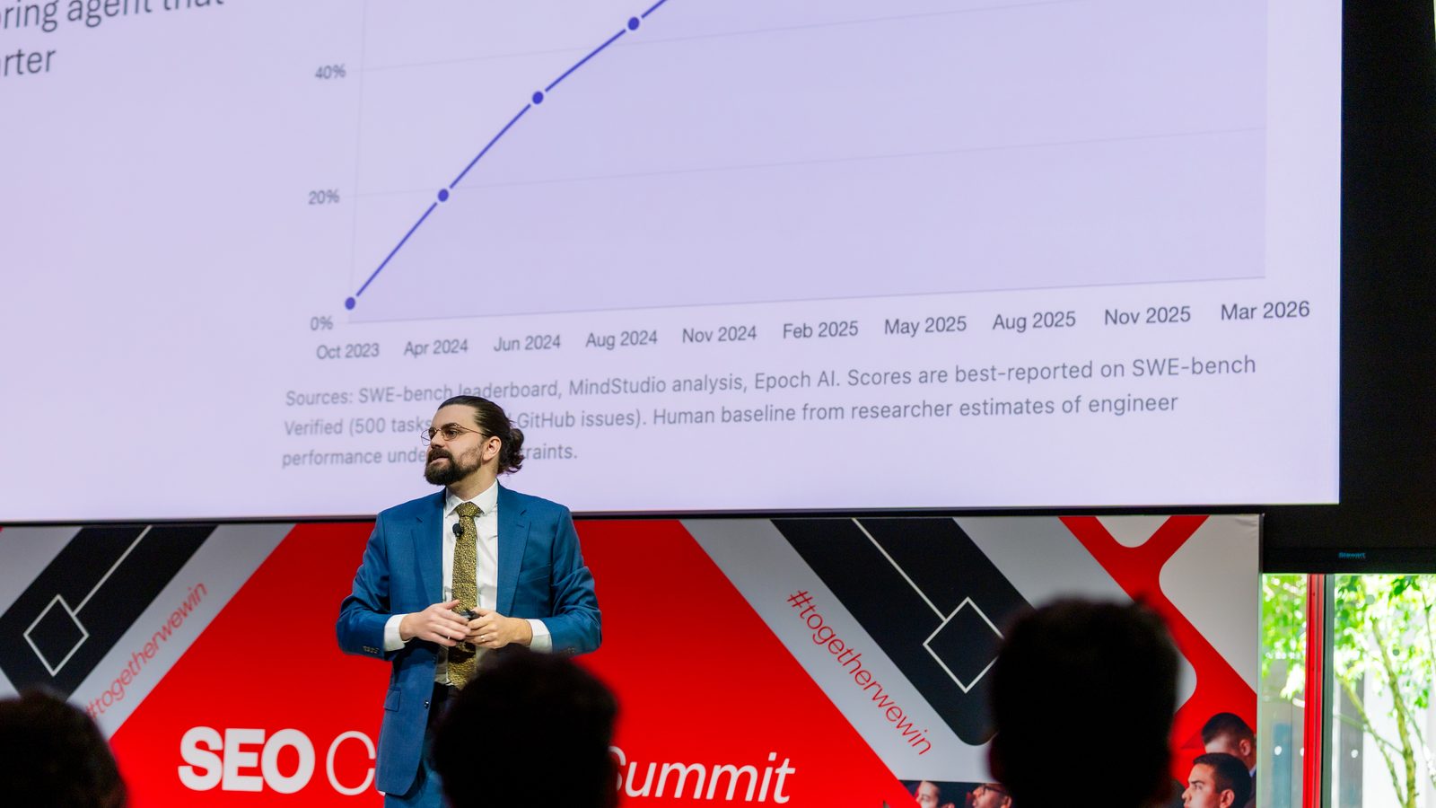 Connor Koblinski presenting on AI progress at the SEO Career Summit